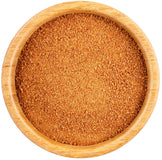 Image of brown Coconut Palm Sugar in a wooden bowl