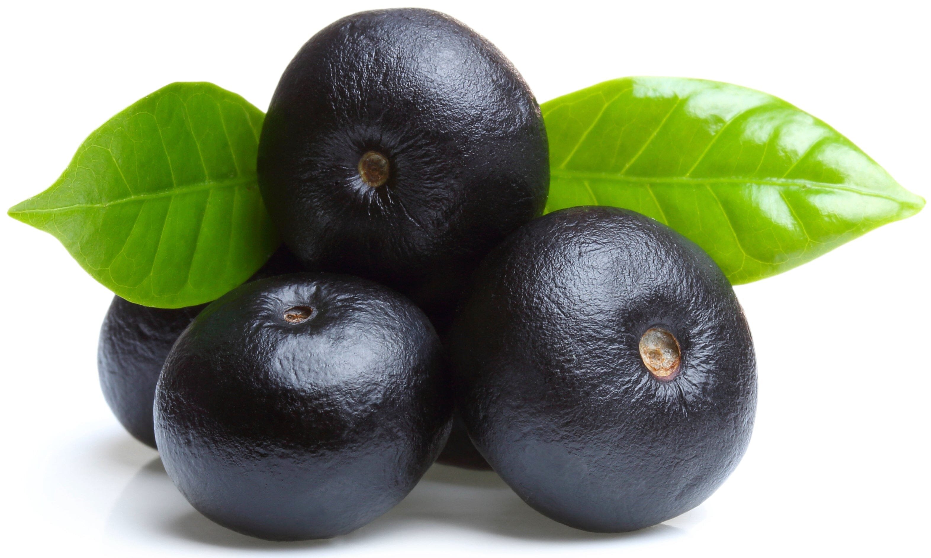 Image of multiple fresh acai berries and green leaves