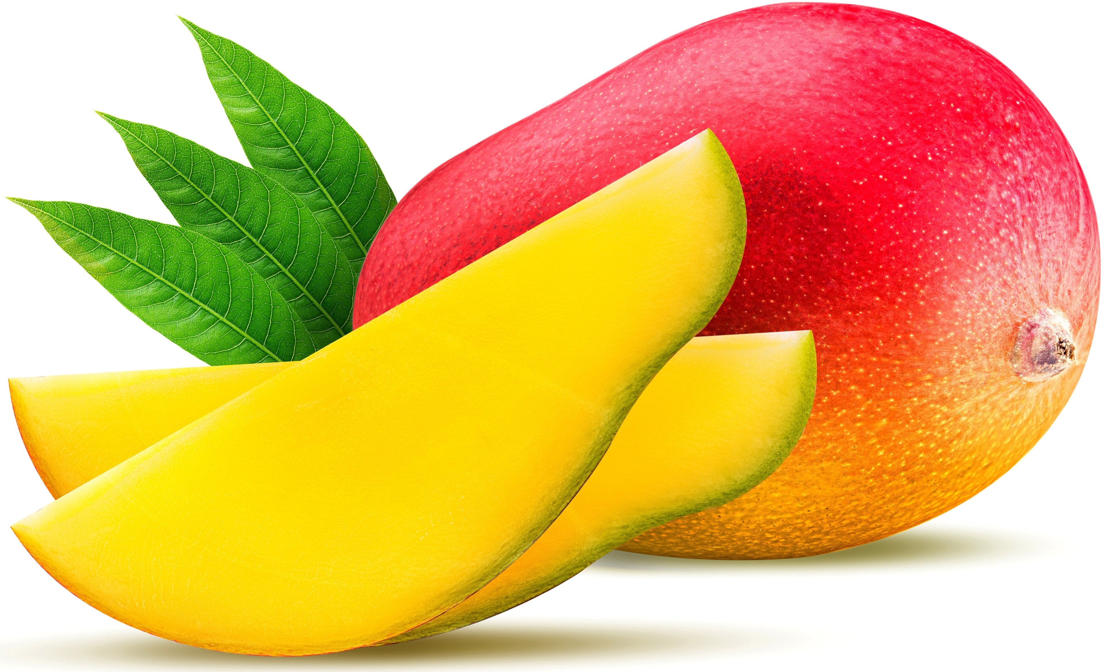 Two lengthwise slices of Mango fruit with whole mango fruit in the background.