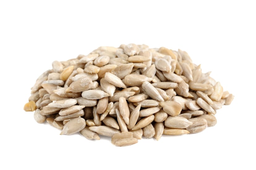Closeup image of Sunflower Seed Kernels - Organic Raw on white background