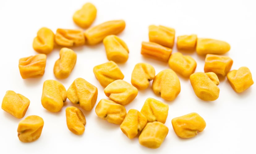 Closeup image of Fenugreek Seeds on white background