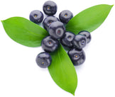 Image of multiple fresh acai berries and green leaves