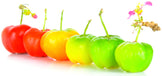 Image of six Acerola Cherries aligned in a row with varying shades of ripeness.
