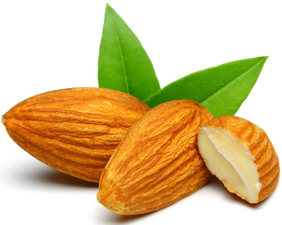 Image of Almonds and a green leaf behind them Z Natural Foods