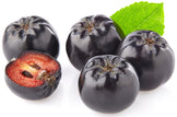 Image of Aronia berries with one green leaf in the back