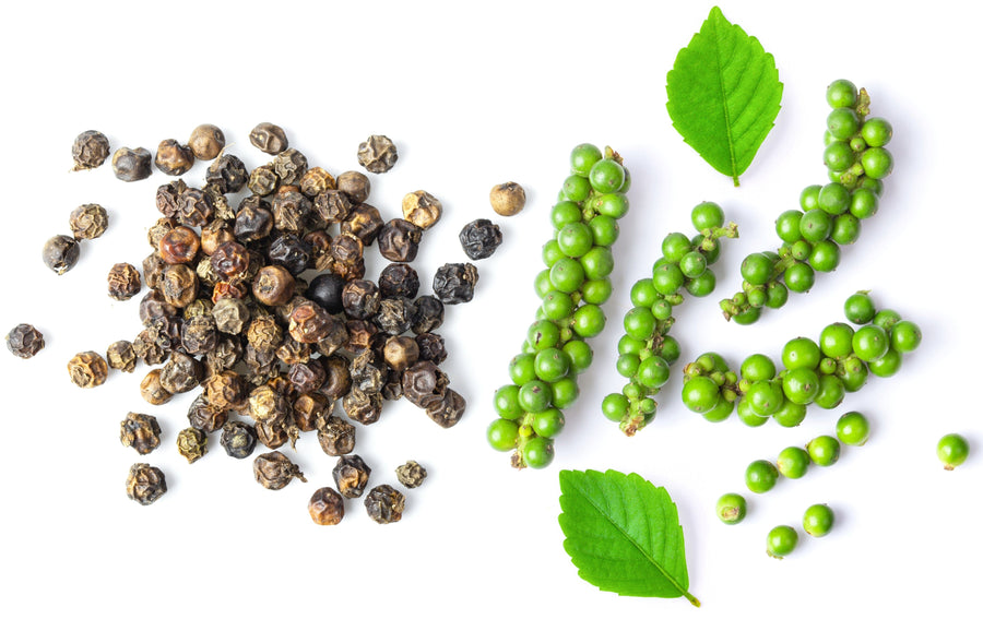 Image of black peppercorns in their whole and unripe state