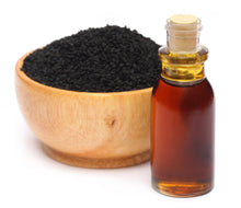 Bottle of Black Seed Oil - Organic with a wooden bowl of black seeds in the background.