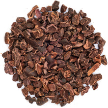 Overhead image of multiple Cacao Nibs on white background