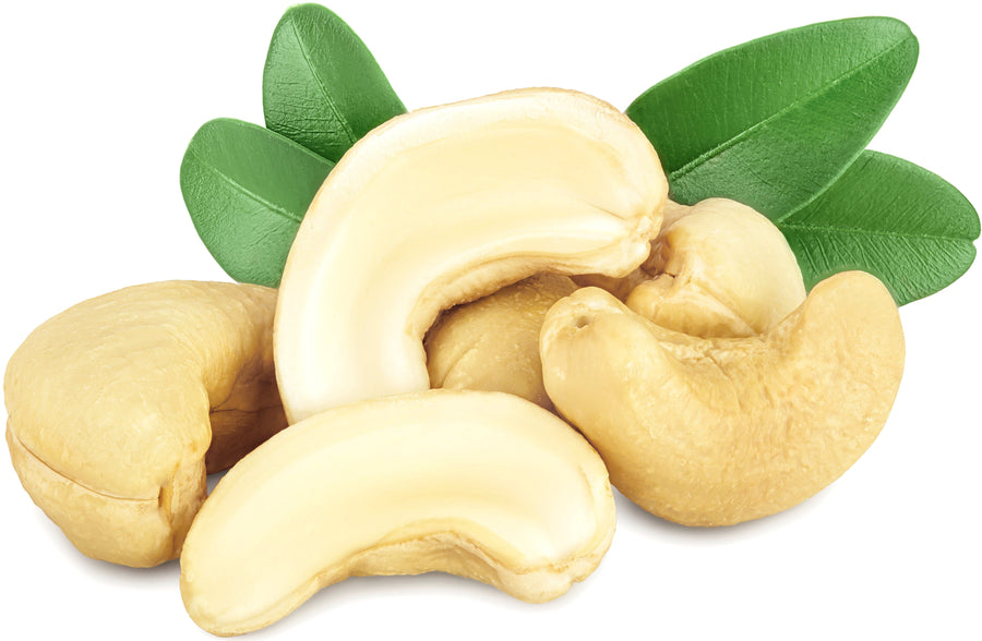 Image of whole cashews and cashew pieces and green leaves