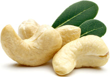 Image of 3 Cashews - Organic, Whole, Raw and green leaves