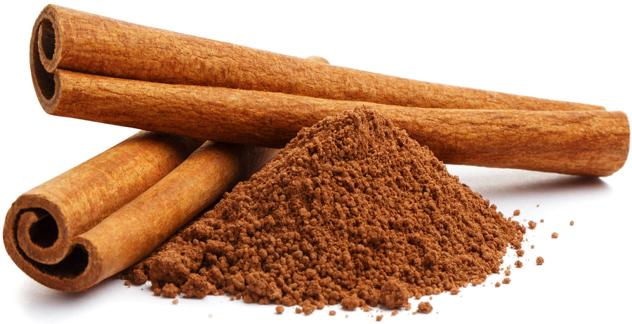 Image of 2 cinnamon sticks next to cinnamon powder