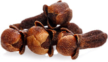 Cloves piled together on white background