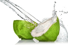 Image of Coconut Water splashing from half a green coconut