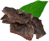 Image of 3 pieces of dried Fo-Ti Root  and a green leaf