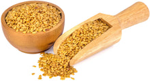 Image of wooden bowl containing Golden Flax Seeds with wooden serving spoon holding additional golden flax seeds.