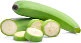 Photo of whole green unripe banana with slices of unripe banana 