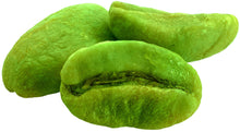 Closeup photo of 3 raw green coffee beans 