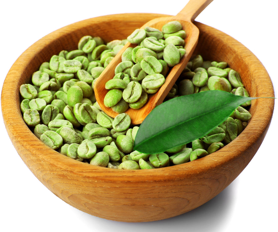 Image of Green Coffee Beans in wooden bowl with wooden serving spoon. 