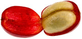 Close-up photo of a ripe red coffee cherry cut in half showing the light colored fresh seed inside - Z Natural Foods