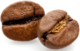 Close-up photo of 2 halves of dark brown roasted coffee beans - Z Natural Foods