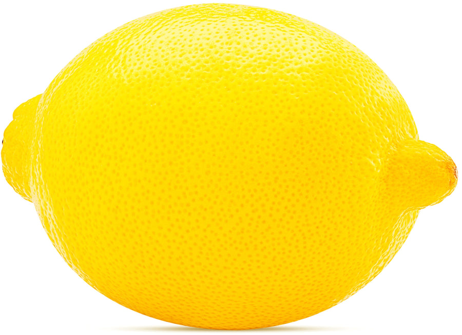 Image of whole lemon laying sideway on white background.
