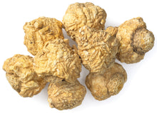 Image of whole raw yellow Maca Root on white background