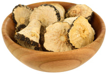 Image of wooden bowl containing several maca root chunks.