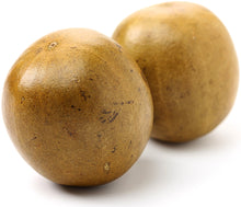 Image of 2 whole brown Luo Han Guo fruits