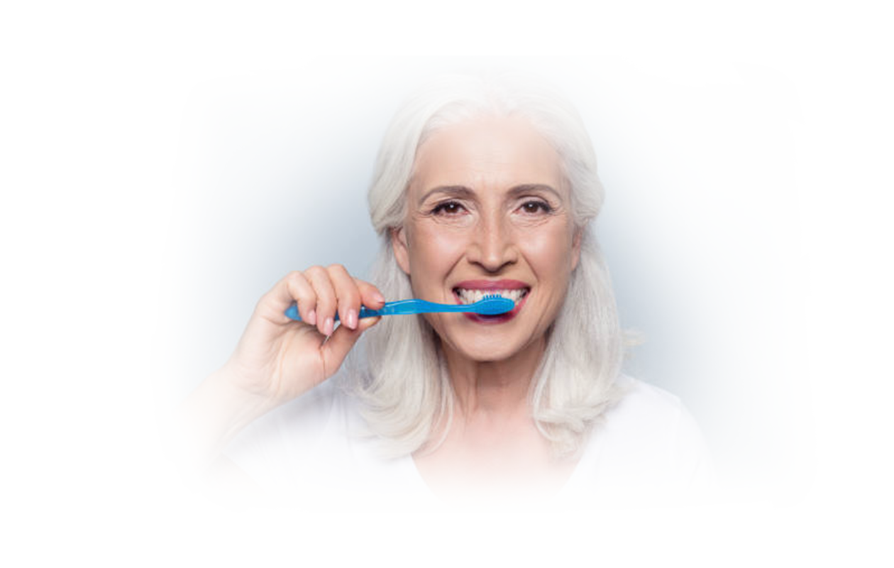 Image of woman brushing teeth.