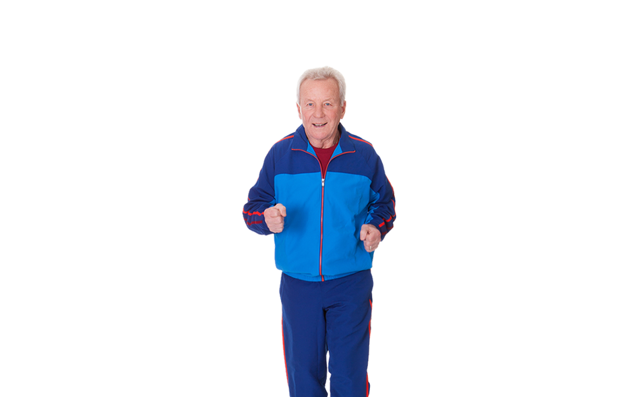 Photo of older man looking happy while jogging and wearing blue jumpsuit 