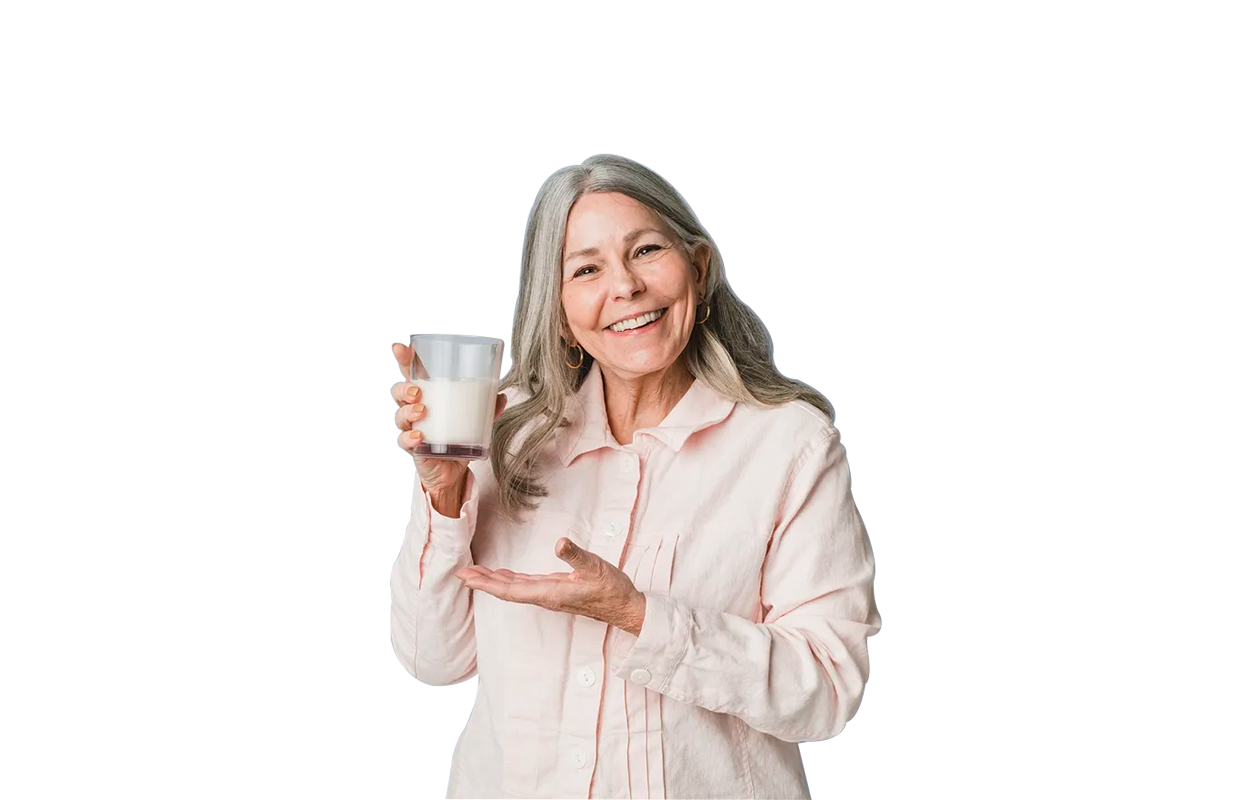 Image of smiling woman holding her homemade smoothie.