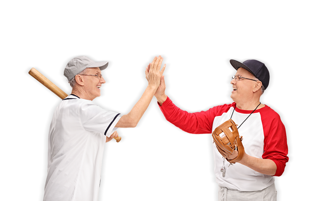 Image of two older baseball players giving high five to each other.