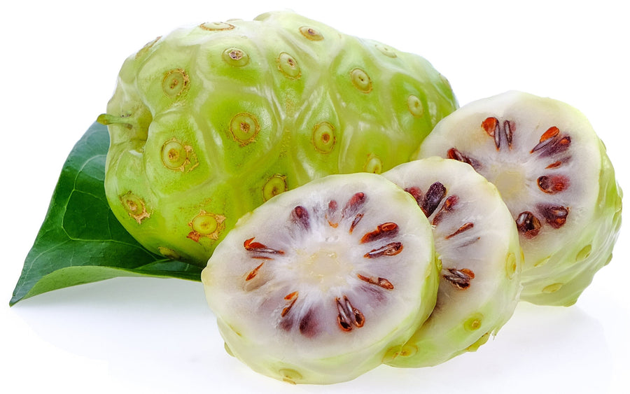 Image of a whole fresh noni fruit and some noni fruit slices