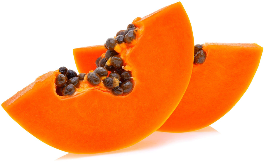 Close photo of 2 bright orange slices of fresh yummy papaya with some seeds on white background