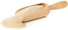 Image of Psyllium Husk (Whole Flakes) in wooden serving spoon on white background.