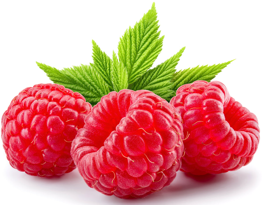 Three red Raspberries with green leaves in background.