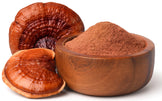Close up Image of 2 Red Reishi Mushroom and a wooden bowl full of powder