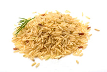 Brown Rice piled together on white background