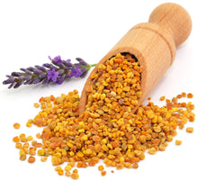 Image of Spanish Bee Pollen overflowing from wooden serving scoop on white background