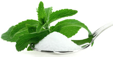 Stevia Extract Powder on metal spoon with green leaf