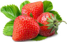 3 Strawberries clustered together surrounded by green leaves