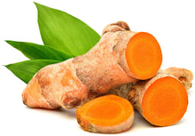 Image of Turmeric root sliced with 3 green leaves
