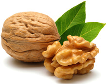 Image of Walnut with walnut kernel in the background.
