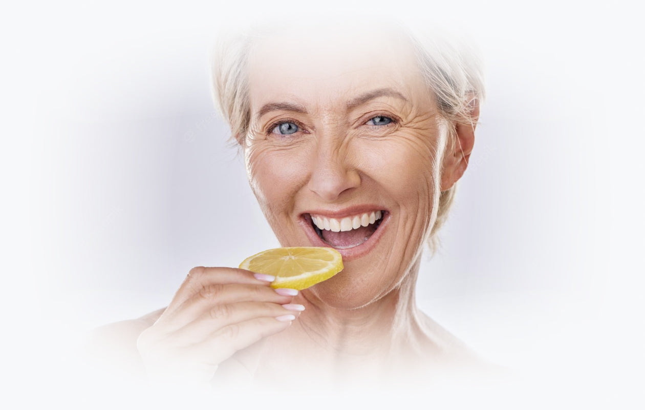 Image of woman about to eat a slice of lemon
