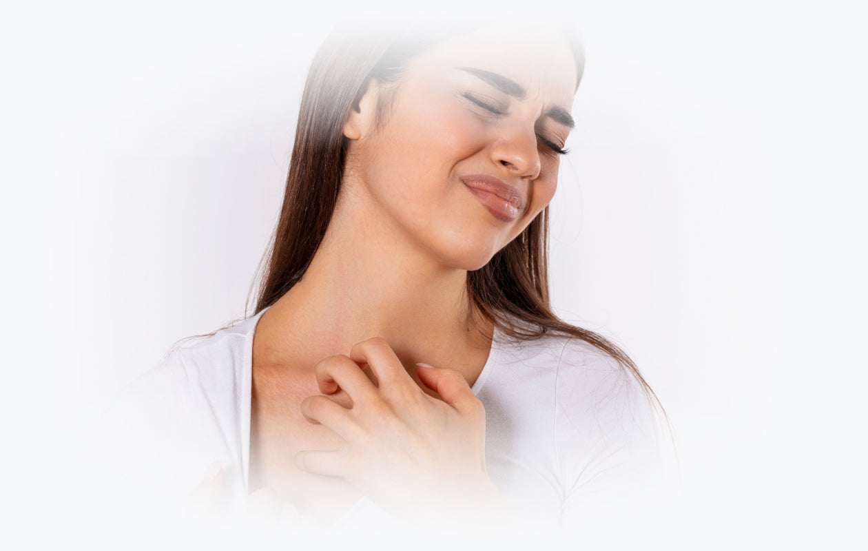 Image of woman scratching at skin on neck because of Dermatitis.
