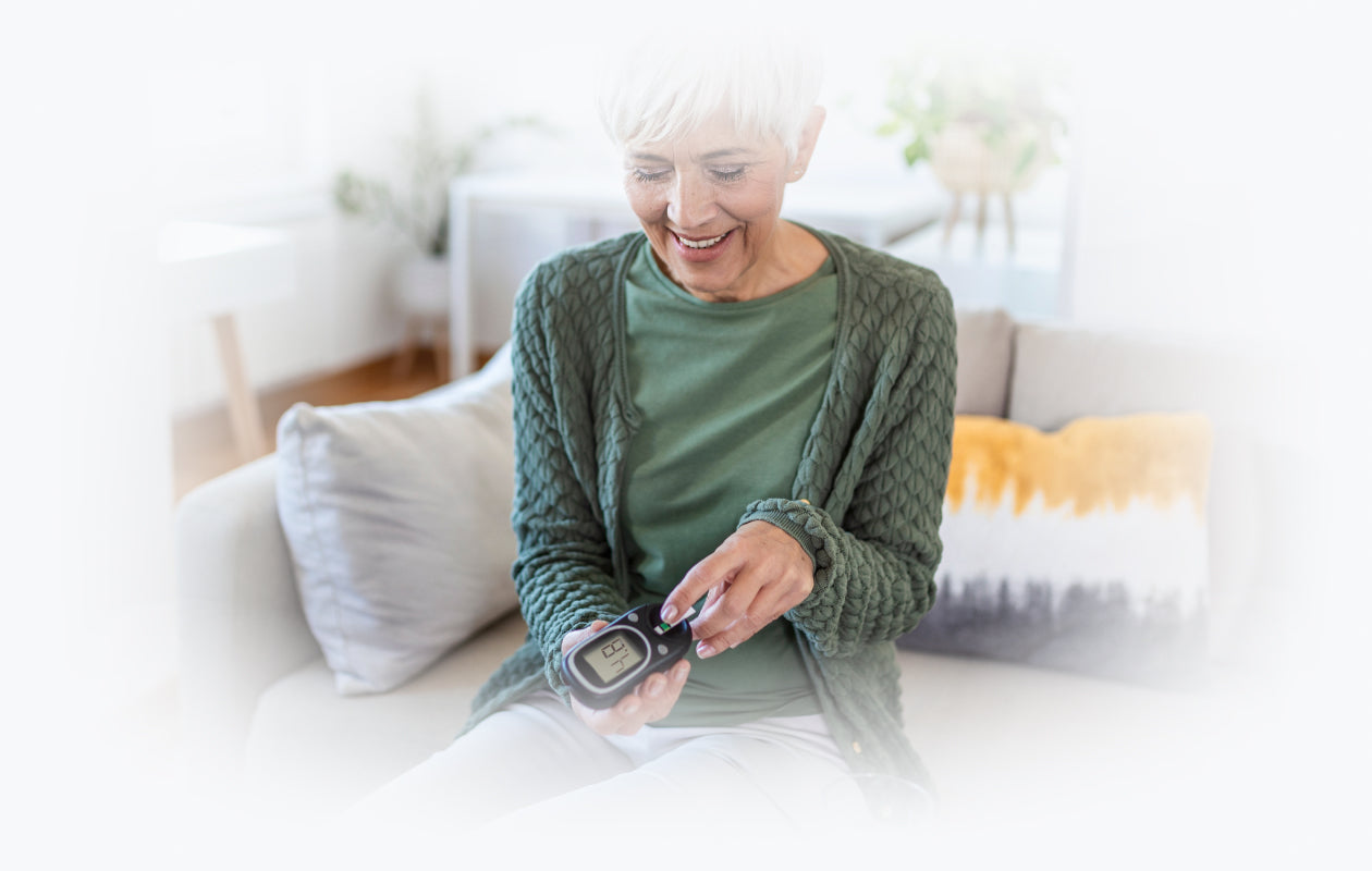 Image of older woman testing her blood sugar with glucose meter.